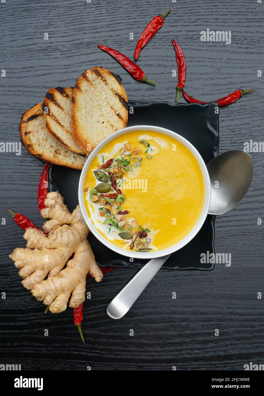 Spicy healthy ginger-pumpkin puree soup Stock Photo