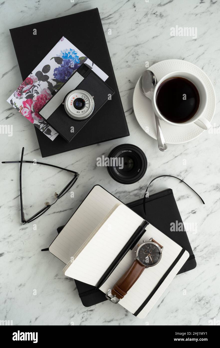 Marble table in the home office of a photographer, blogger or designer Stock Photo