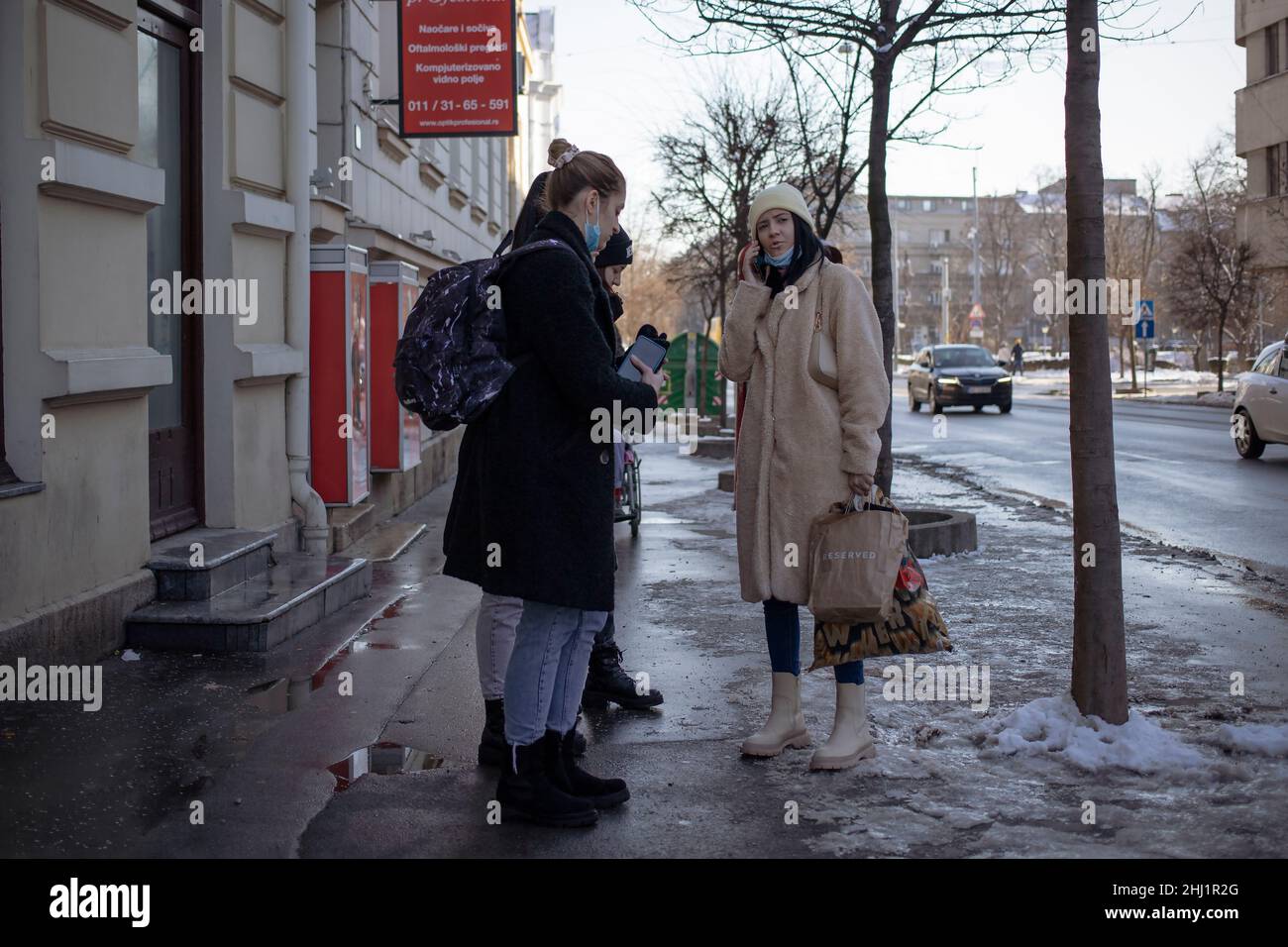 Belgrade, Serbia, Jan 23, 2022: Young women chatting on the street Stock Photo