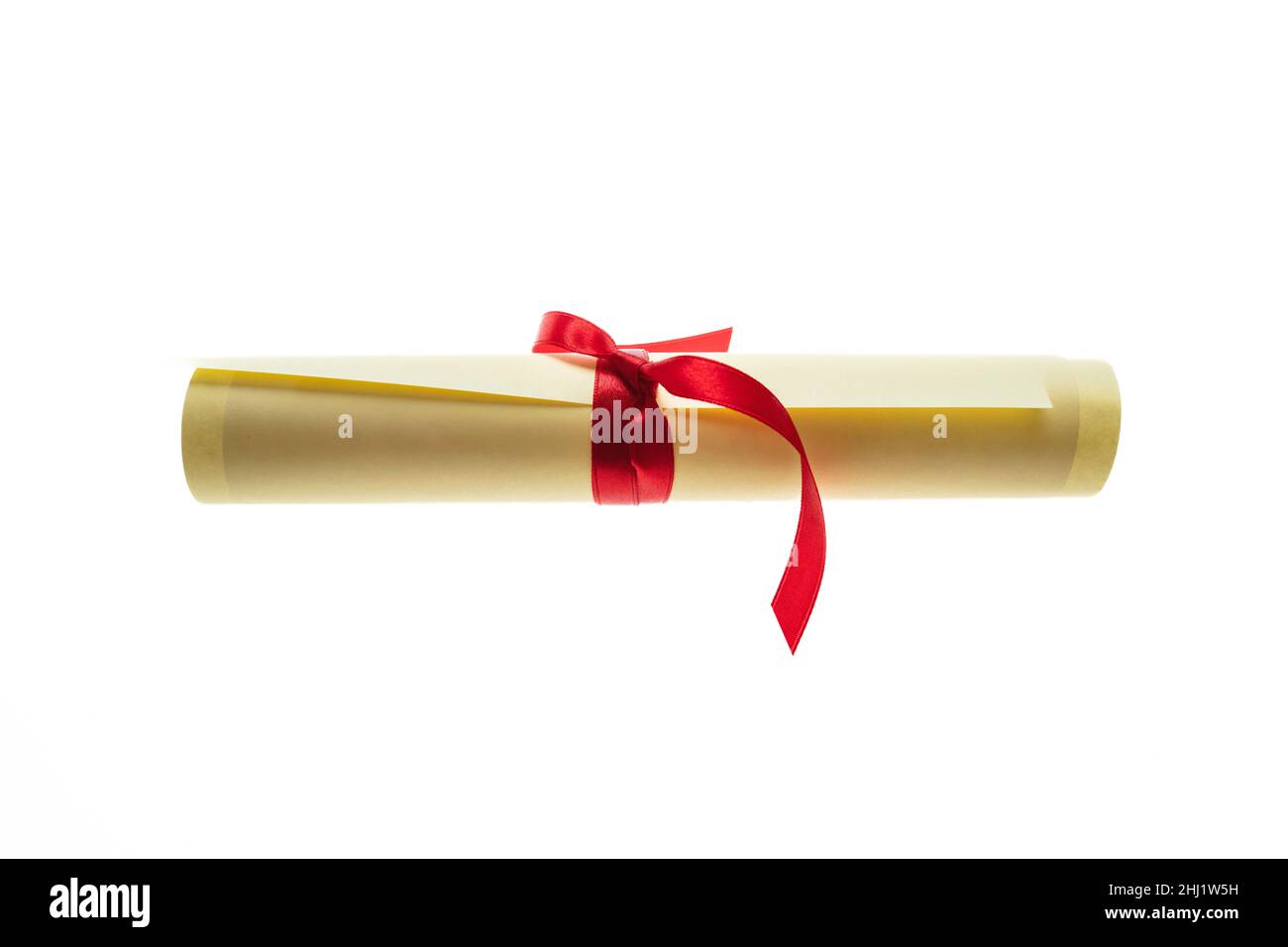 Diploma scroll with red ribbon isolated cutout on white background. College degree paper certificate roll, University graduation, education, studies c Stock Photo