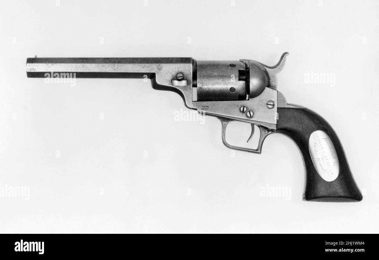 Pocket Model Colt Revolver 1848 American In 1835 and 1836, the American inventor and industrialist Samuel Colt (1814–1862) patented a revolutionary type of multishot pistol that is still used today. Colt's revolvers had a rotating cylinder that could be loaded with several rounds and fired quickly by cocking and releasing the hammer or, in later models, by simply pulling the trigger. Early Colt firearms used percussion ignition and had to be loaded with powder, bullets, and ignition caps in separate operations. After 1870, Colt models were produced for self-contained cartridges that are much l Stock Photo