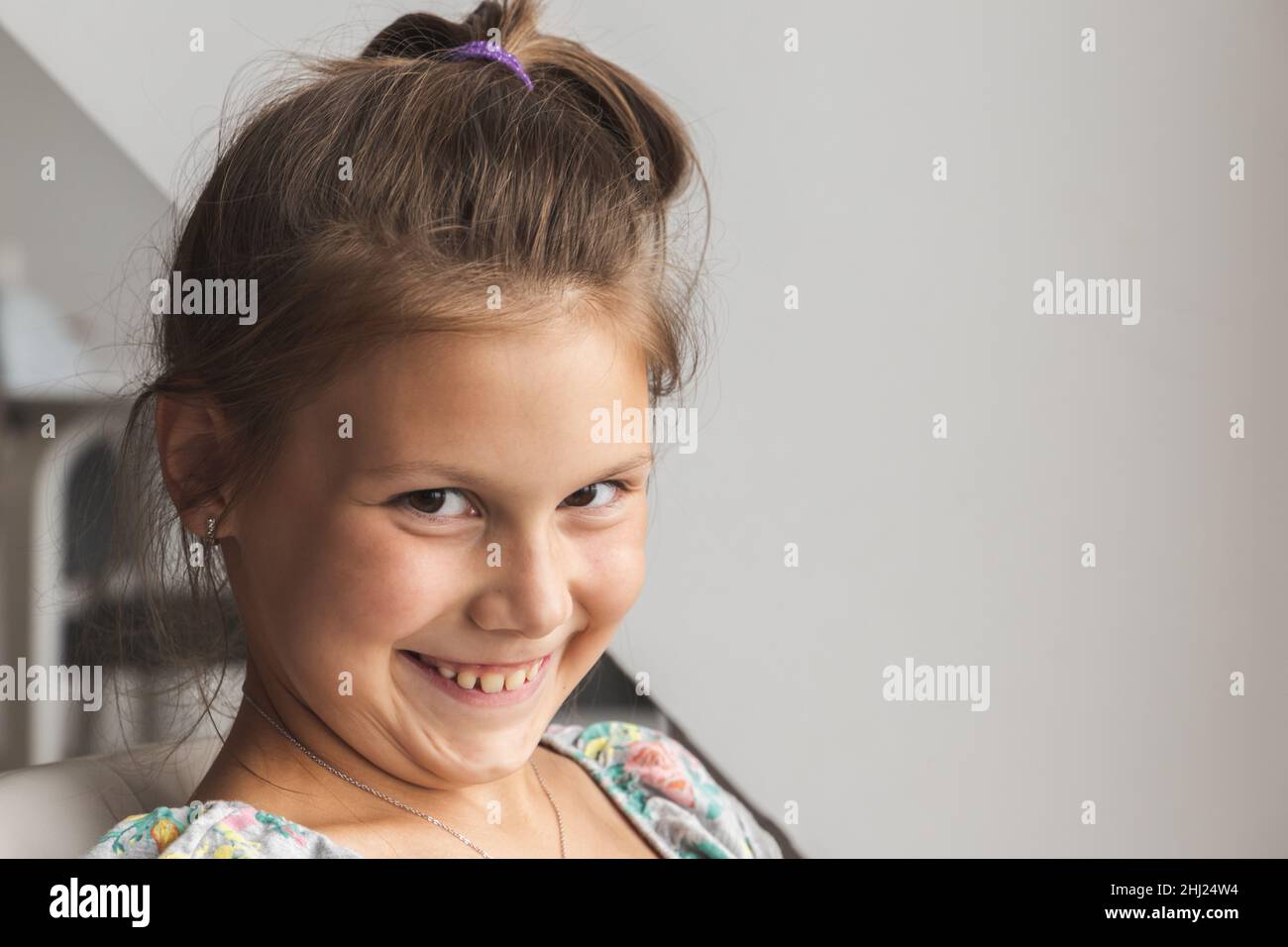 Close up studio portrait of funny little Caucasian girl Stock Photo