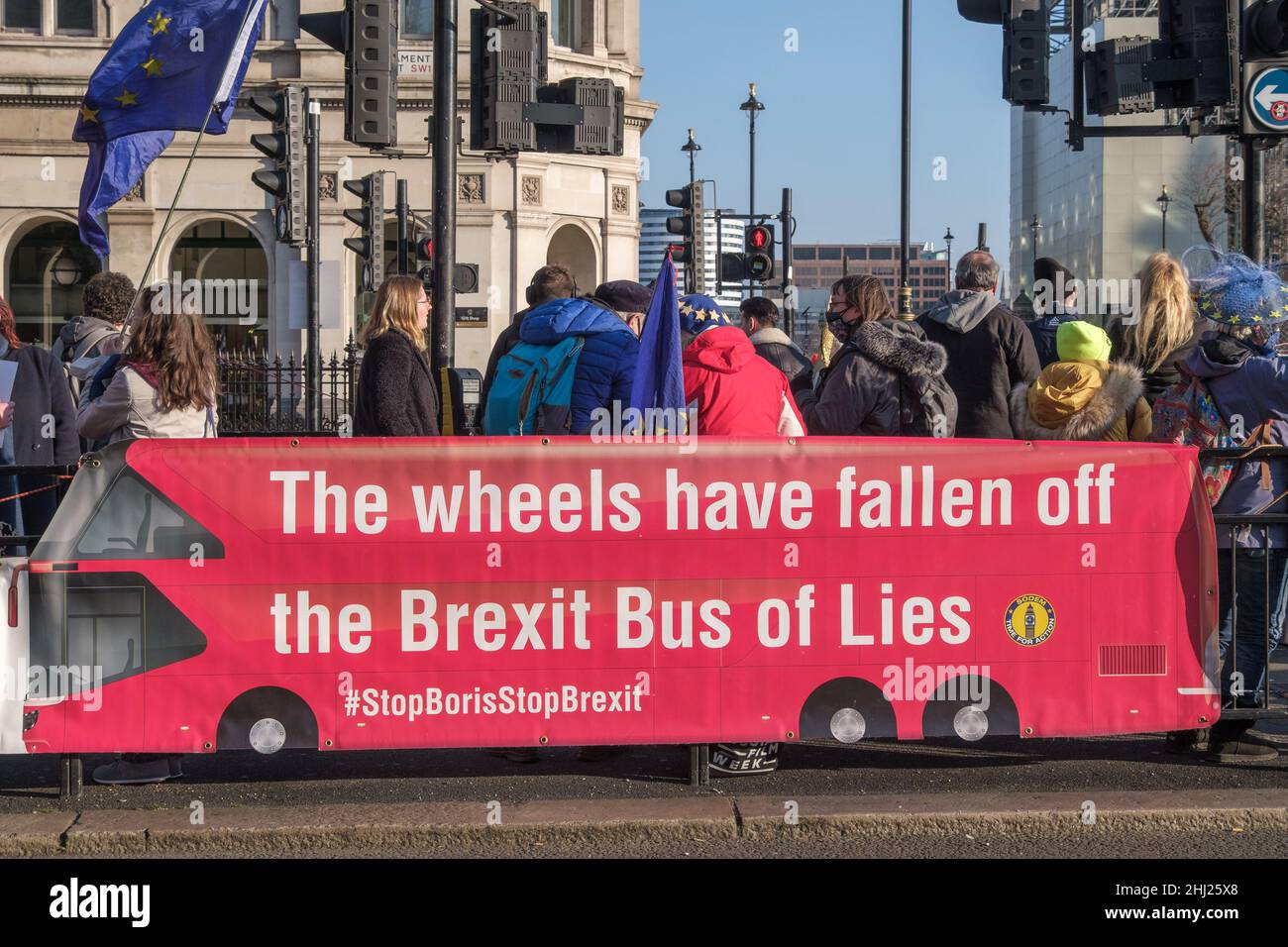 London, UK, 26th Jan 2022. The Wheels have fallen off the Brexit Bus of Lies #StopBorisStopBrexit. Steven Bray and his Stand of Defiance European Movement  continue their protests outside Parliament with banners and posters against Boris Johnson and the corrupt Tory government. Placards and banners show Downing St as a crime scene and call on Johnson to resign and question if the Gray report will be yet another whitewash. They call Johnson a pathological liar. Peter Marshall/Alamy Live News Stock Photo