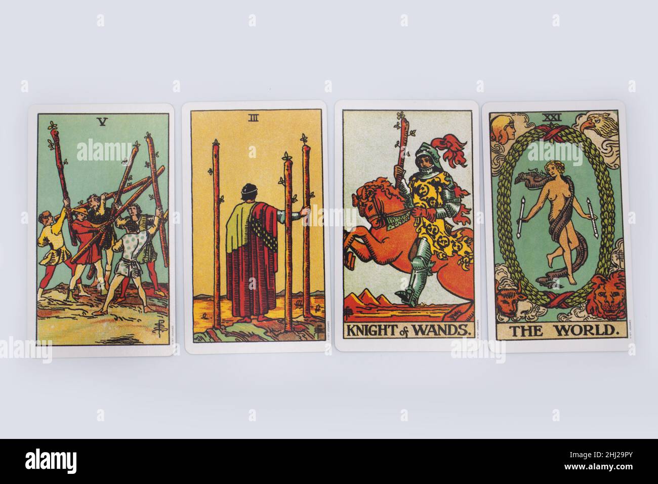 A spread of four tarot cards from a traditional pack. Stock Photo