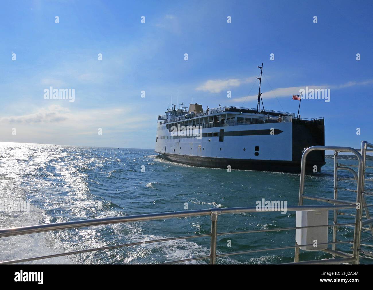 Martha’s Vineyard car Ferry at dusk with blue sky, American Flag