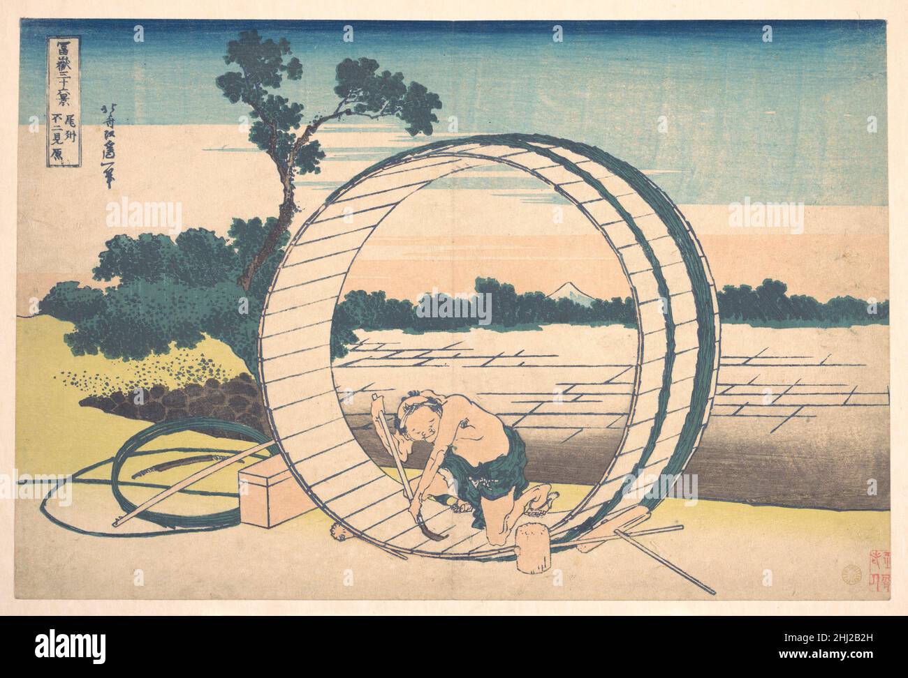 Fujimigahara in Owari Province (Bishū Fujimigahara), from the series Thirty-six Views of Mount Fuji (Fugaku sanjūrokkei) ca. 1830–32 Katsushika Hokusai Japanese By framing Fuji and the cooper in the interior of the large barrel, Hokusai effects an intimate dialogue between the iconic mountain and the sinewy man. The juxtaposition of Fuji and the cooper lends a religious overtone to the man's honest labor and existence.. Fujimigahara in Owari Province (Bishū Fujimigahara), from the series Thirty-six Views of Mount Fuji (Fugaku sanjūrokkei)  36500 Stock Photo