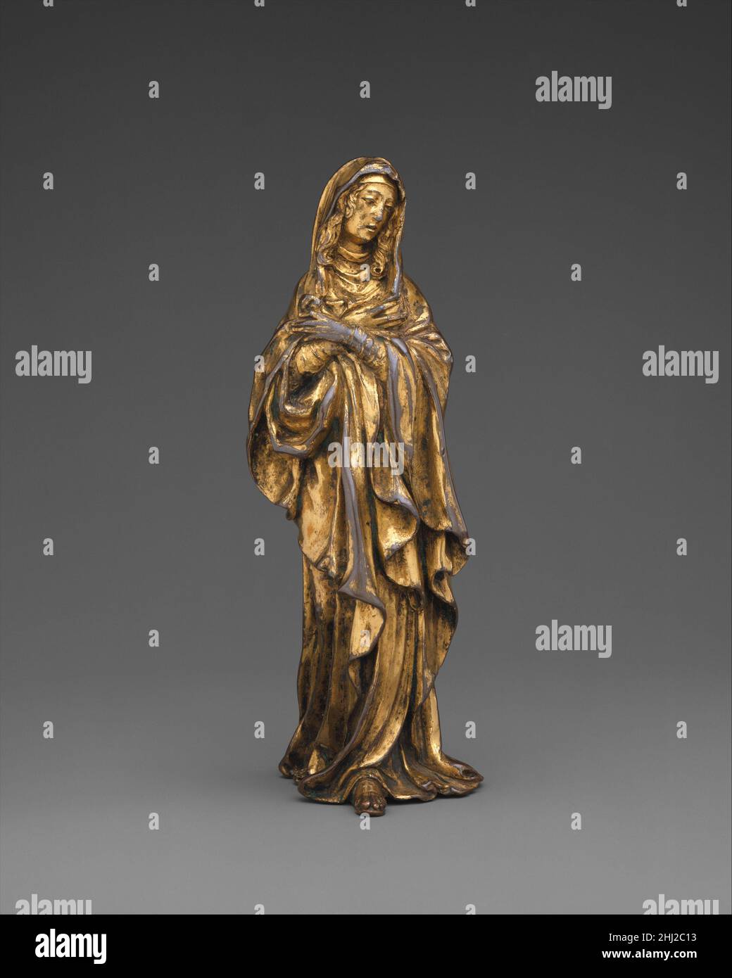 The Virgin Mary ca. 1585–90 Manner of Germain Pilon French This figure comes from a Crucifixion group in which the Virgin and Saint John the Evangelist would have flanked Christ on the Cross. The slender proportions and flowing drapery folds relate closely to Germain Pilon’s Mourning Virgin (ca. 1585), commissioned by Catherine de Médicis (1519–1589) for her funerary chapel at Saint-Denis.. The Virgin Mary  209328 Stock Photo