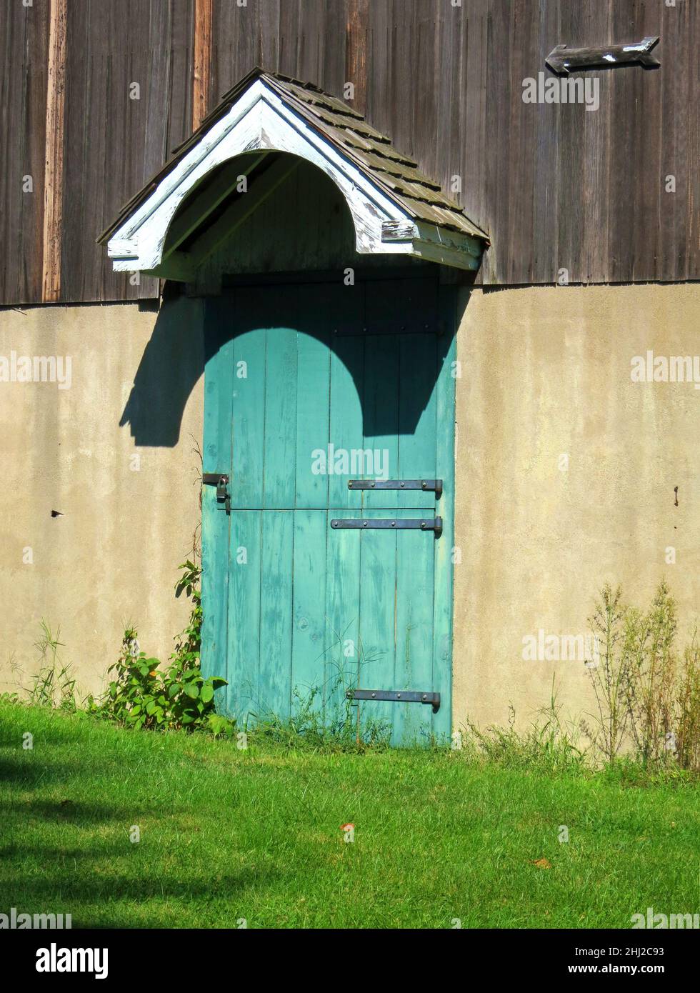 Barn door, old blue and green,with lock, hinges and small roof cover