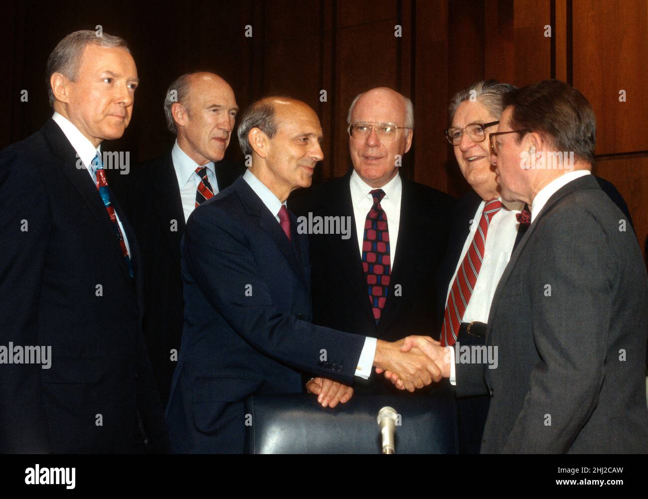 United States Senator Paul Simon (Democrat of Illinois), right, welcomes Chief Judge of the US Court of Appeals for the First Circuit, Stephen G. Breyer, US President Bill Clintons nominee to replace the retiring Justice Harry Blackmun as Associate Justice of the US Supreme Court, third left, to his confirmation hearing on Capitol Hill in Washington, DC on July 12, 1994. From left to right; US Senator Orrin Hatch (Republican of Utah), US Senator Alan Simpson (Republican of Wyoming), Judge Breyer, United States Senator Patrick Leahy (Democrat of Vermont), US Senator Howell Heflin (Democrat of Stock Photo