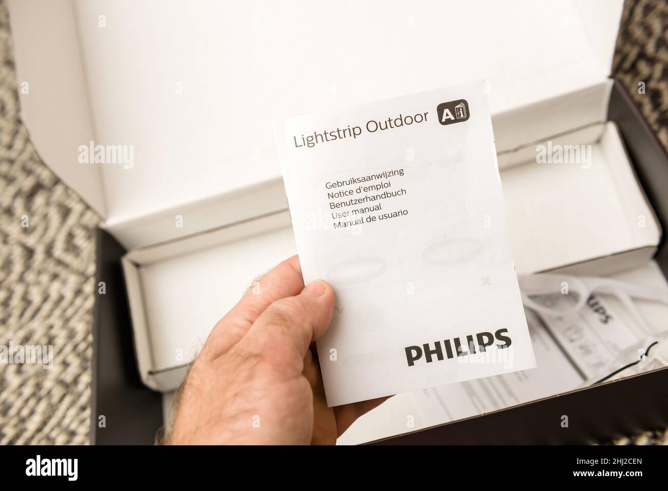 Paris, France - Nov 29, 2021: reading manual after unboxing unpacking new  Philips Signify HUE white and color ambiance lightstrip outdoor 5 meter  smart Stock Photo - Alamy