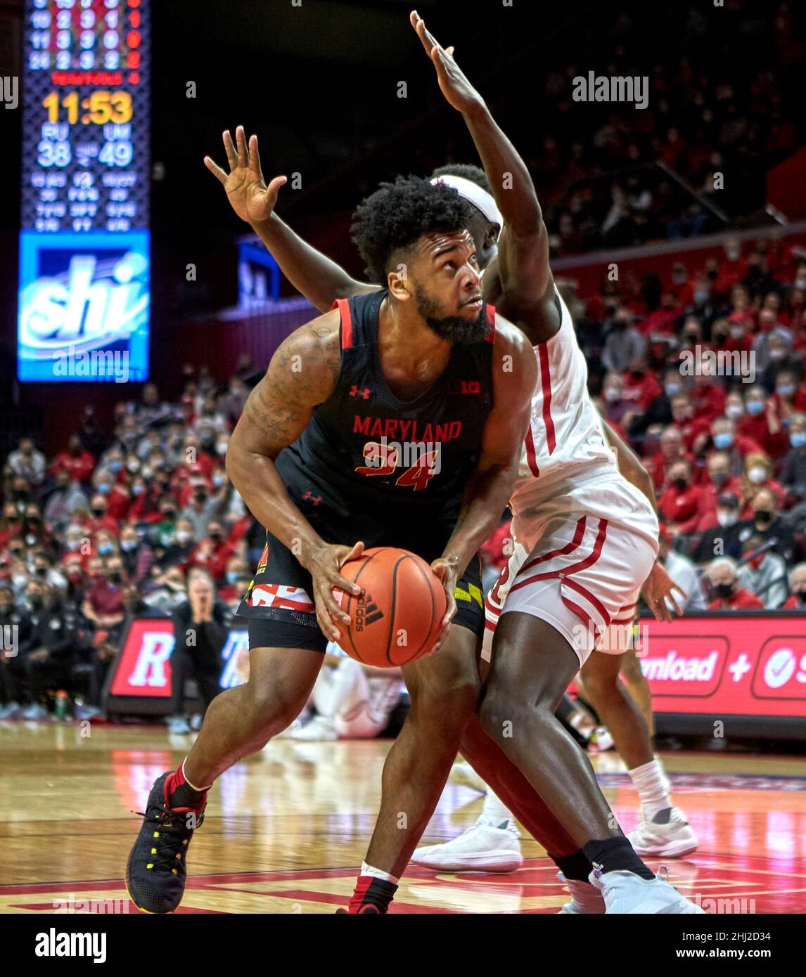 Piscataway, New Jersey, USA. 26th Jan, 2022. Maryland Terrapins forward Donta Scott (24) makes a move to the basket on Rutgers Scarlet Knights forward Mawot Mag (3) in the second half during NCAA basketball action at Jersey Mikes Arena in Piscataway, New Jersey. Maryland defeated Rutgers 68-60. Duncan Williams/CSM/Alamy Live News Stock Photo