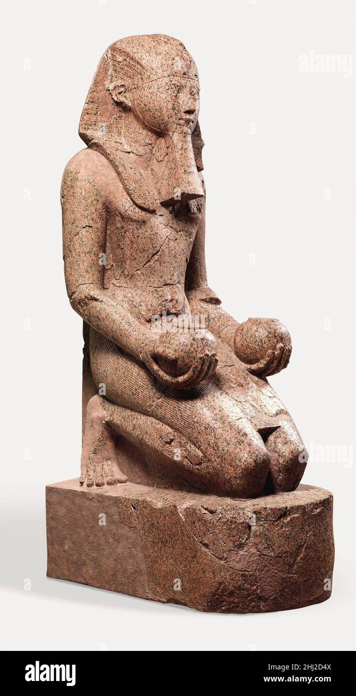 Large Kneeling Statue of Hatshepsut ca. 1479–1458 B.C. New Kingdom On the upper terrace of Hatshepsut's temple at Deir el-Bahri, the central sanctuary was dedicated to the god Amun-Re, whose principal place of worship was Karnak temple, located across the Nile, on the east bank of the river. During a yearly festival, called the Beautiful Feast of the Valley, the god's image was transported across the river to the west bank. Carrying the god in his sacred barque, the festival procession followed a roadway lined with sphinxes that led to Hatshepsut’s temple. On the middle terrace, the pathway wa Stock Photo
