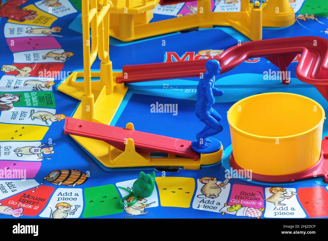 https://c8.alamy.com/comp/2HJ2DCP/close-up-image-of-the-diver-and-mouse-on-mouse-trap-board-gamethe-diver-is-on-the-see-saw-ready-to-dive-into-the-yellow-pool-which-sets-of-the-mouse-2HJ2DCP.jpg