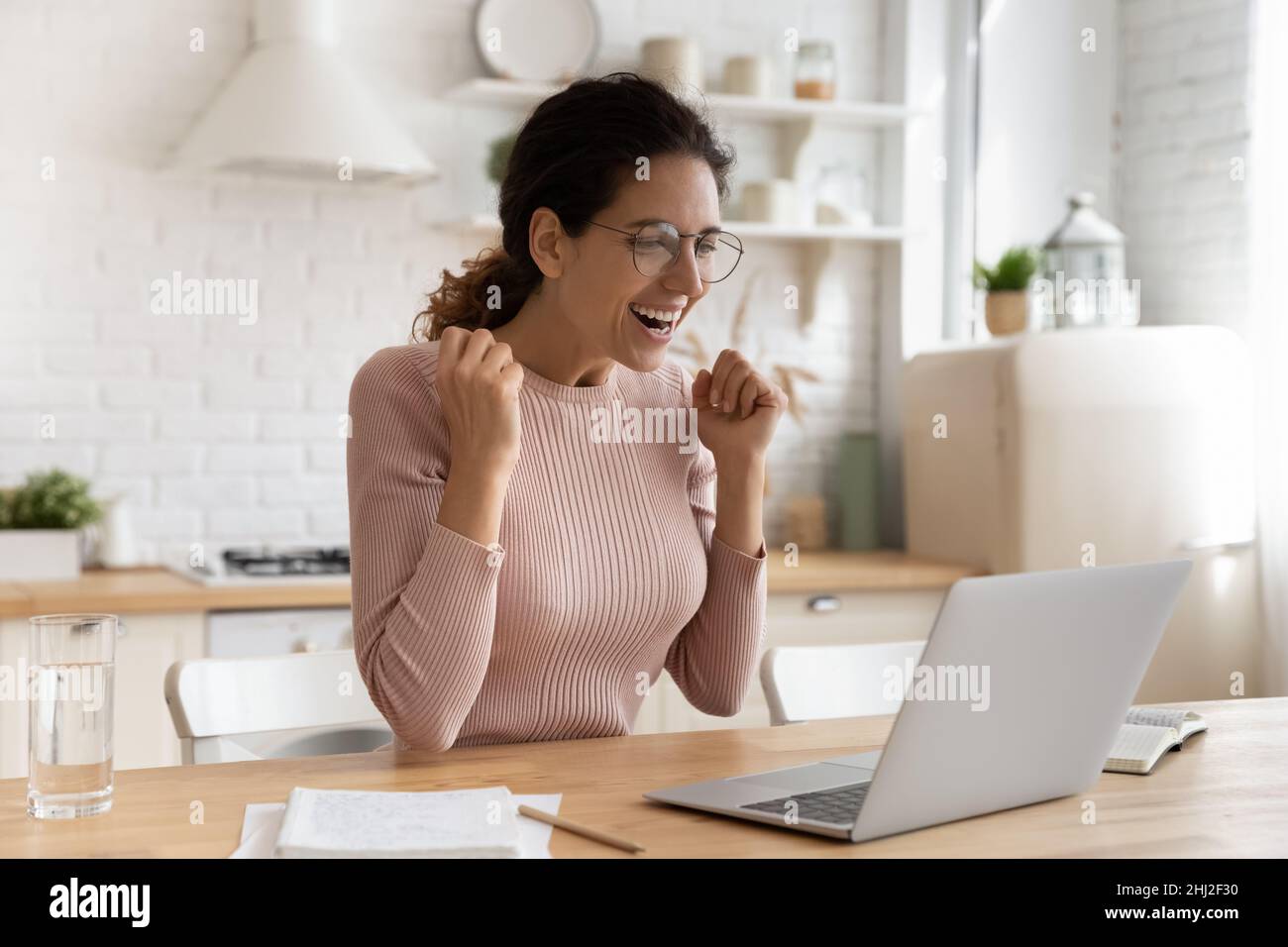Latina student woman read about university admission acceptance feels excited Stock Photo