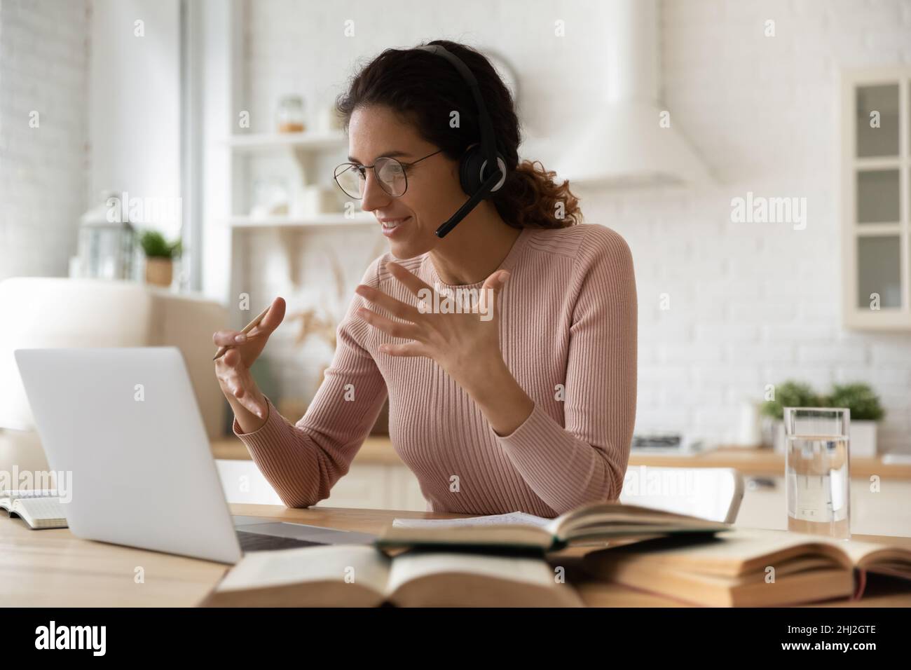 Young woman student e-learn use videoconference app on laptop Stock Photo