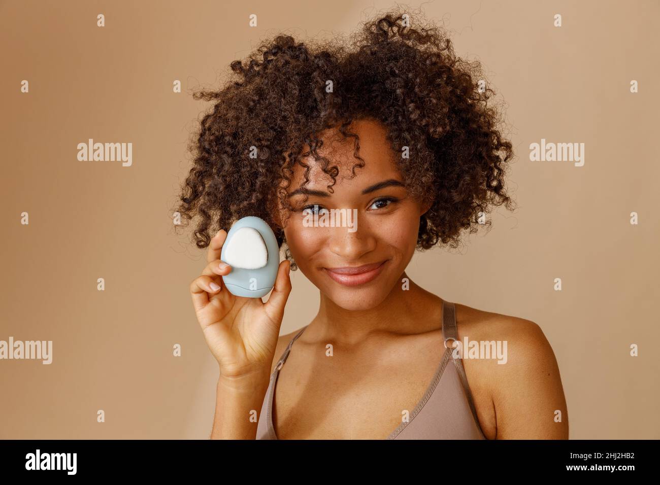 Woman with fluffy curly hair hi-res stock photography and images - Alamy
