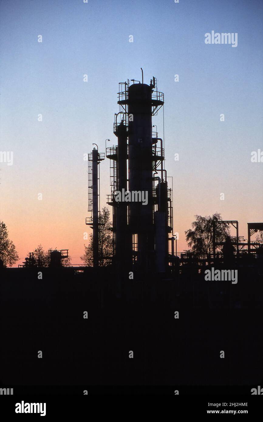 Petrochemical refinery plant silouetted at sunset Stock Photo - Alamy