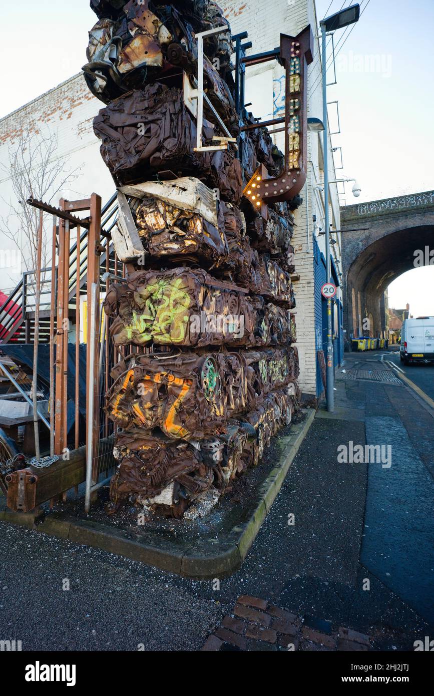 Crushed cars making up a wall at the Custard Factory car park in