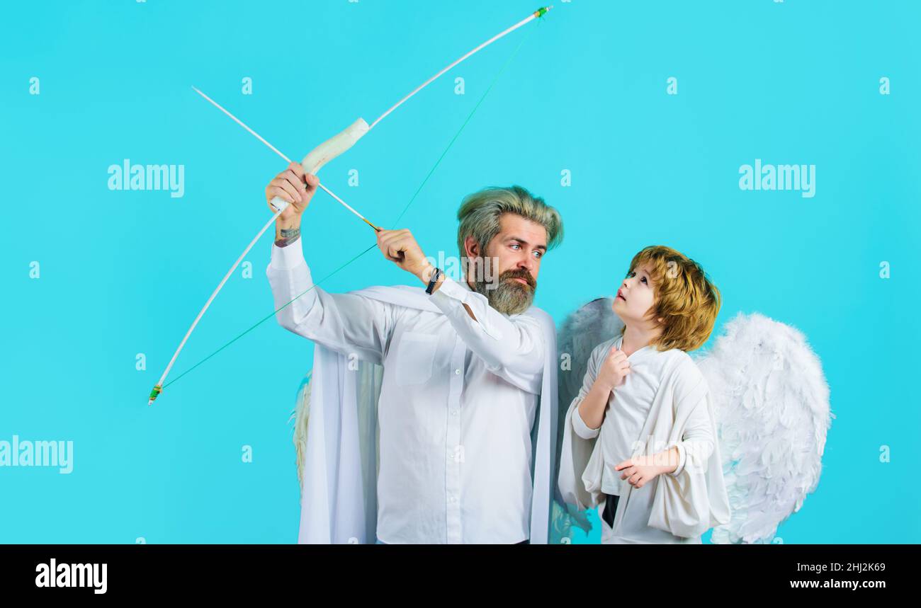 Father with son angels. Cupid with bow and arrow. Arrows of love. Valentines day. Stock Photo