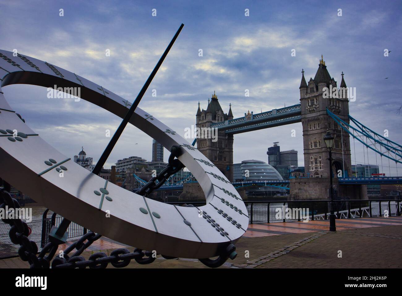 Sundial with tower bridge under cloudy Skys in London Stock Photo Alamy