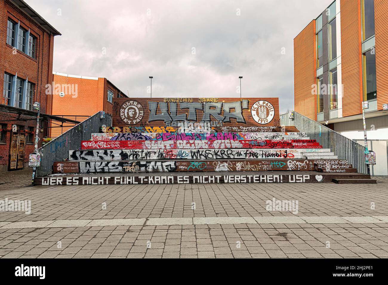 Wooden grandstand for FC St. Pauli football fans, with logo of the Ultra Sankt Pauli group, graffiti and slogans, Hamburg, Germany Stock Photo