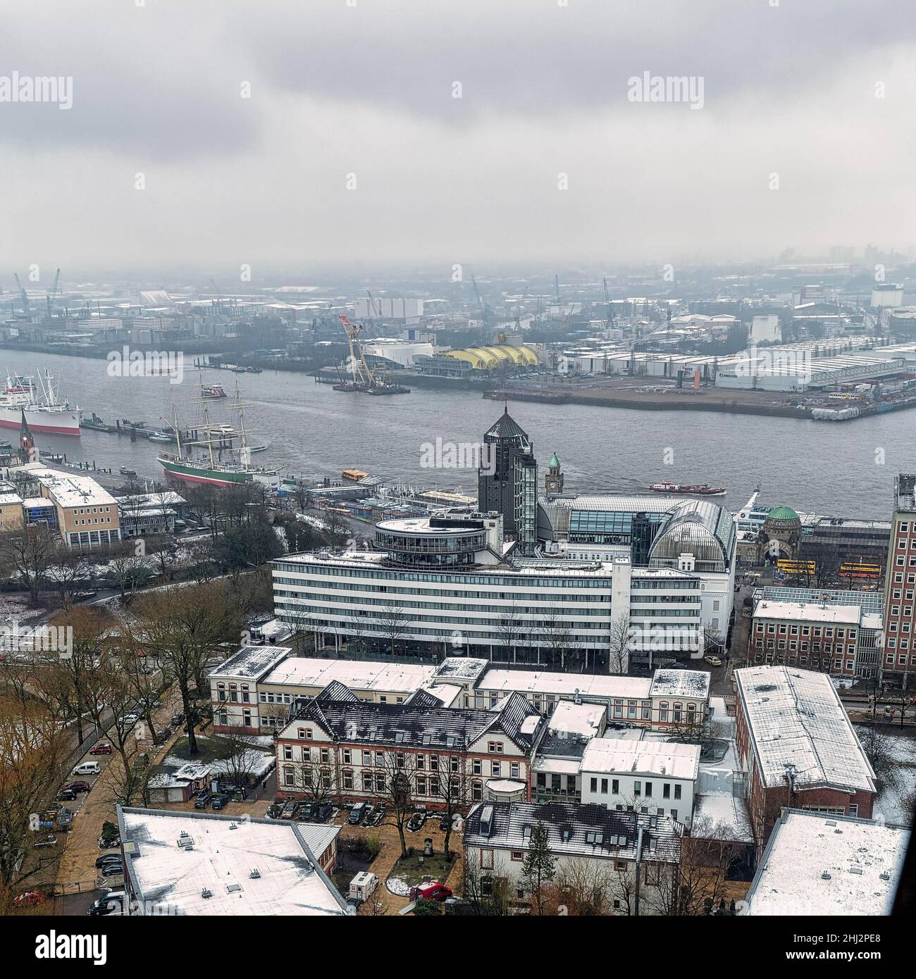 View from above of the Elbe from above, with Landungsbruecken in the haze, dreary winter weather, Mitte district, Hamburg, Germany Stock Photo