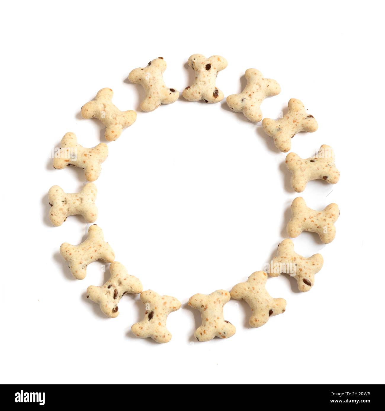 Circle of heathy bone shapes  biscuits treats  used for training and occasions ,  white isolated background  for text over-lay , copy space , packagin Stock Photo