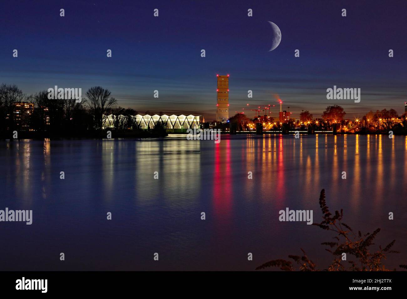 Rhine at night with crescent moon, Birsfelden power station, with Roche Tower, long exposure, Grenzach- Wyhlen, Baden-Wuerttemberg, Germany Stock Photo