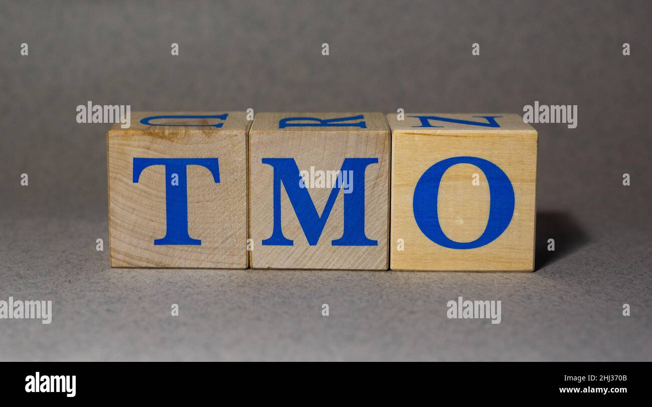 January 19, 2022. New York, USA. The stock Ticker symbol of Thermo Fisher Scientific TMO, made of wooden cubes, on a gray background. Stock Photo