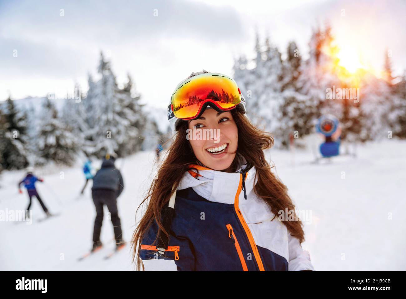 Close up Happy girl enjoying winter moments helmet on his head Stock Photo