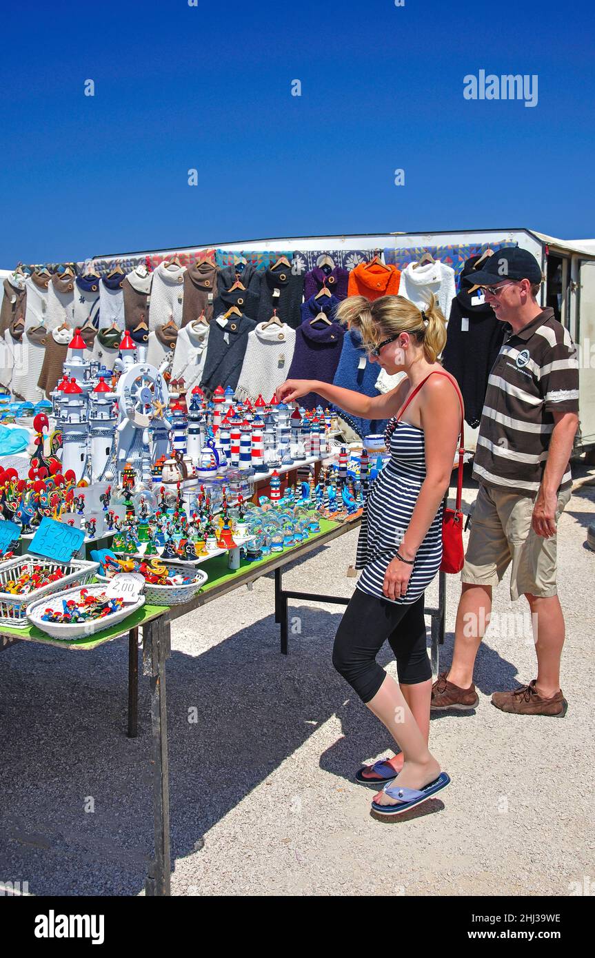 Couple looking at souvenir stall, Cabo de São Vicente, Algarve Region, Portugal Stock Photo