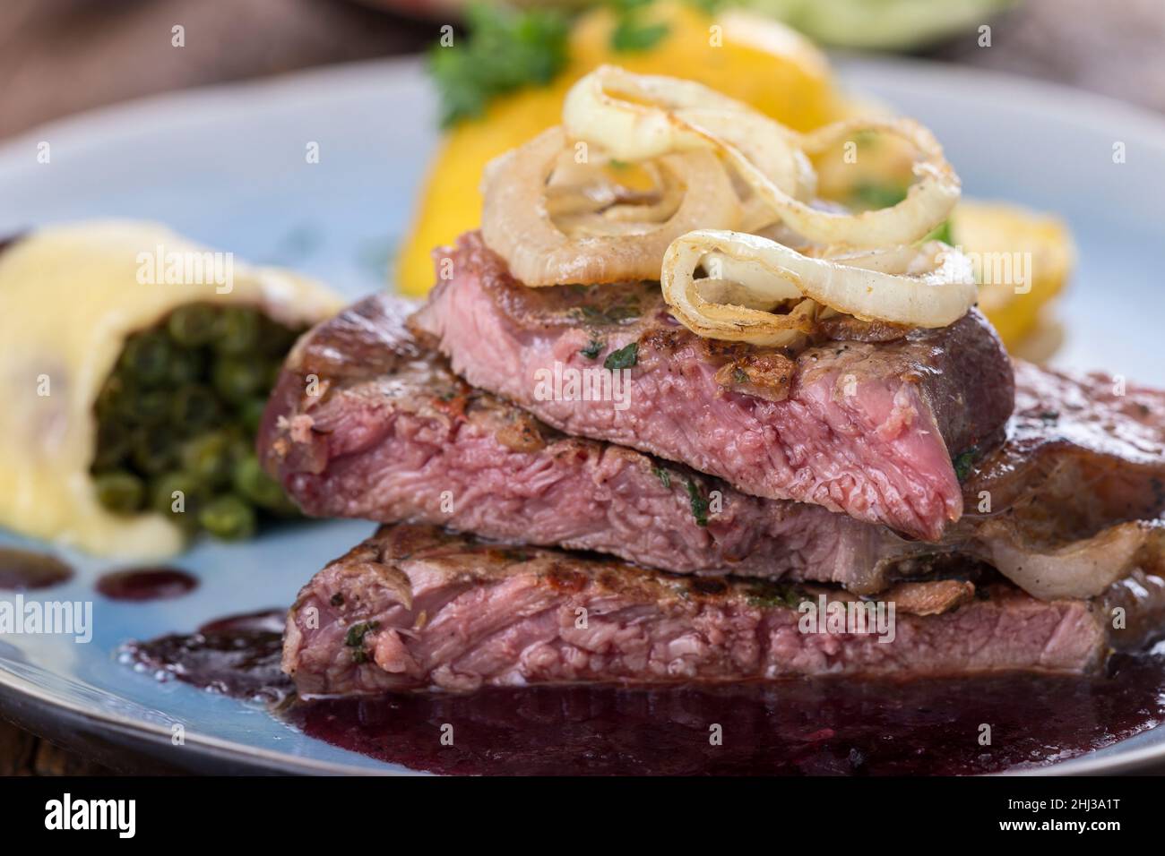 german steak with roasted onions Stock Photo Alamy