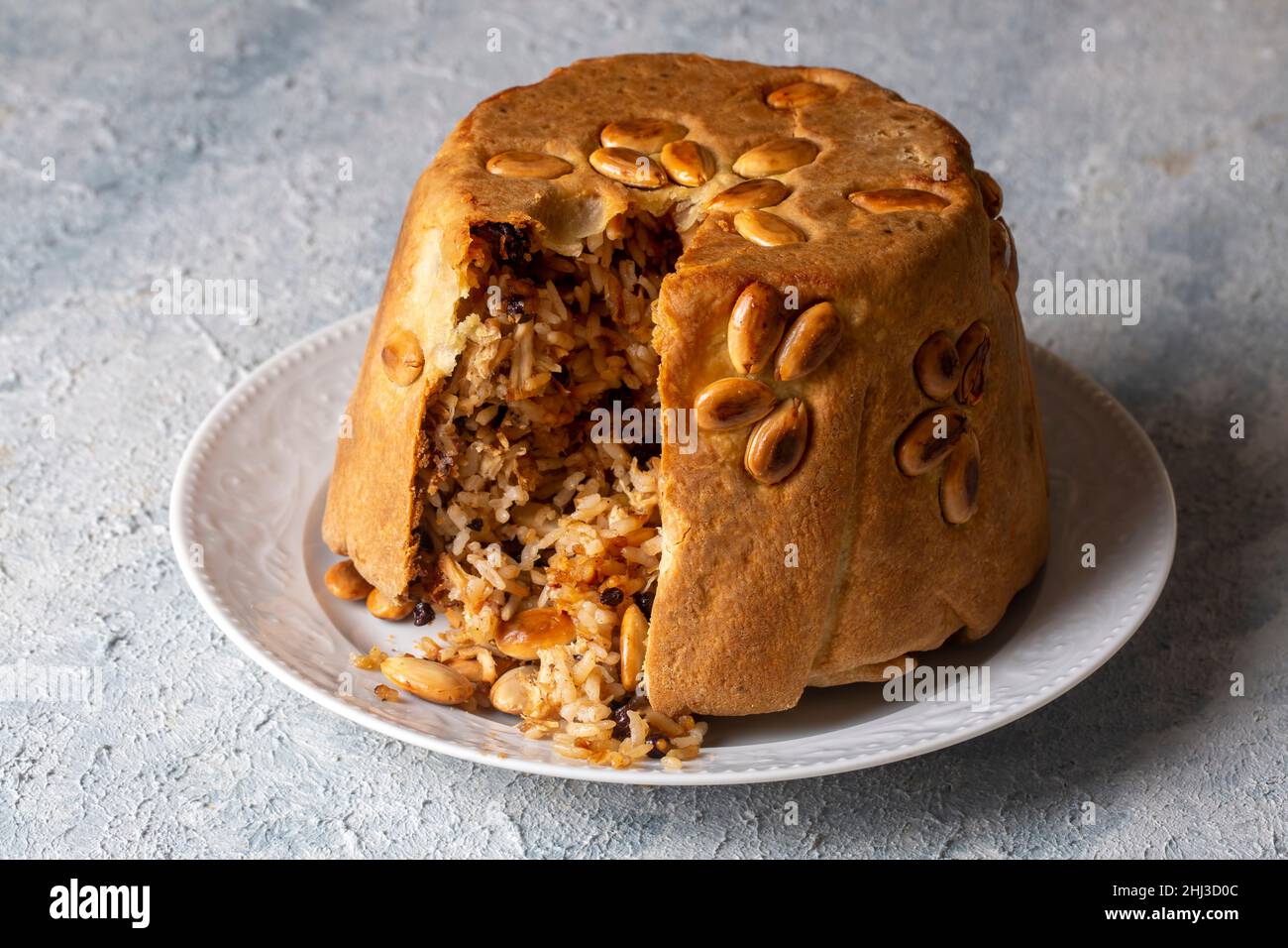 Turkish Perde Pilavi. Drape pilaf with chicken, almond and raisin. A local flavor Rice from Siirt region (Turkish name; Siirt perde pilavi) Stock Photo