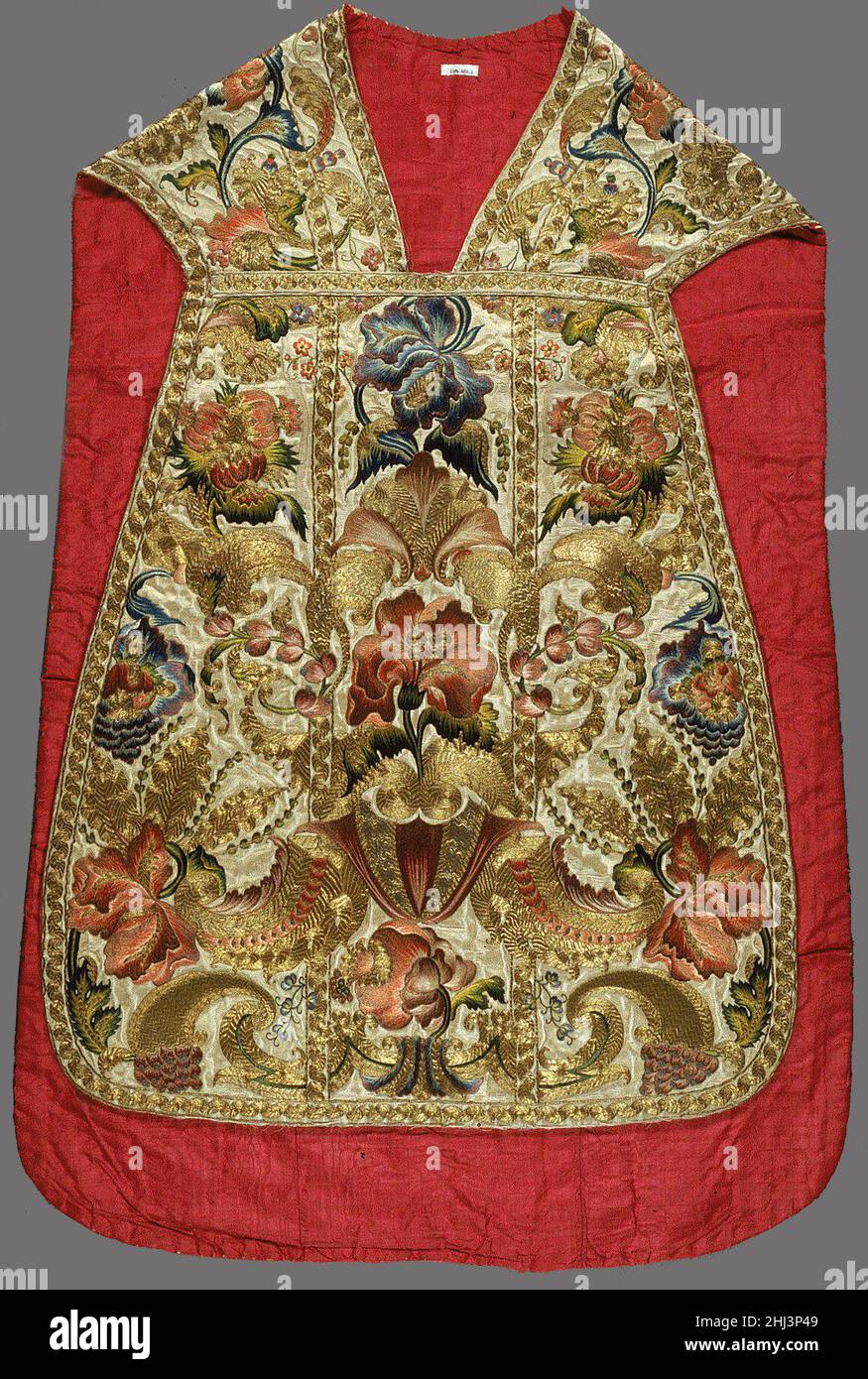 Chasuble (one of a set of five vestments) 18th century Italian, probably Sicily This chasuble is from a set of six vestments—also including a stole, maniple, burse, chalice veil, and chalice cover—whose quality, extent, and provenance make the group an important addition to the Museum's fine collection of ecclesiastical costume. The chasuble's embroidered decoration-a nearly symmetrical pattern of full-blown, seminaturalistic flowers, small blossoms, curving leaves, and scrolls—is an excellent example of the style of late Baroque ornament used to embellish Italian vestments from the end of the Stock Photo