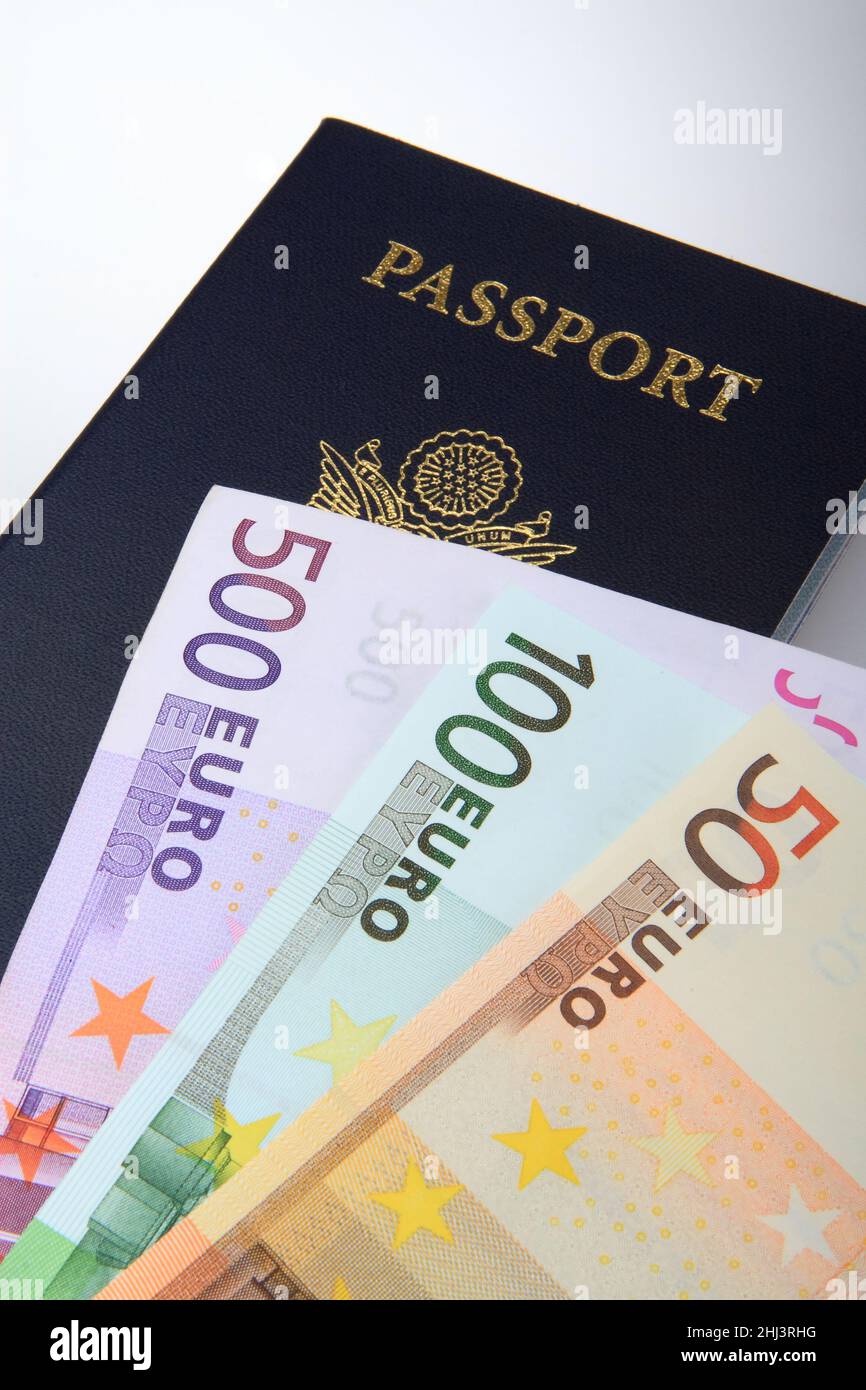 Ready for the trip to Europe, cash on the table, many Euros, passport, all one needs to get on an airplane and go Stock Photo