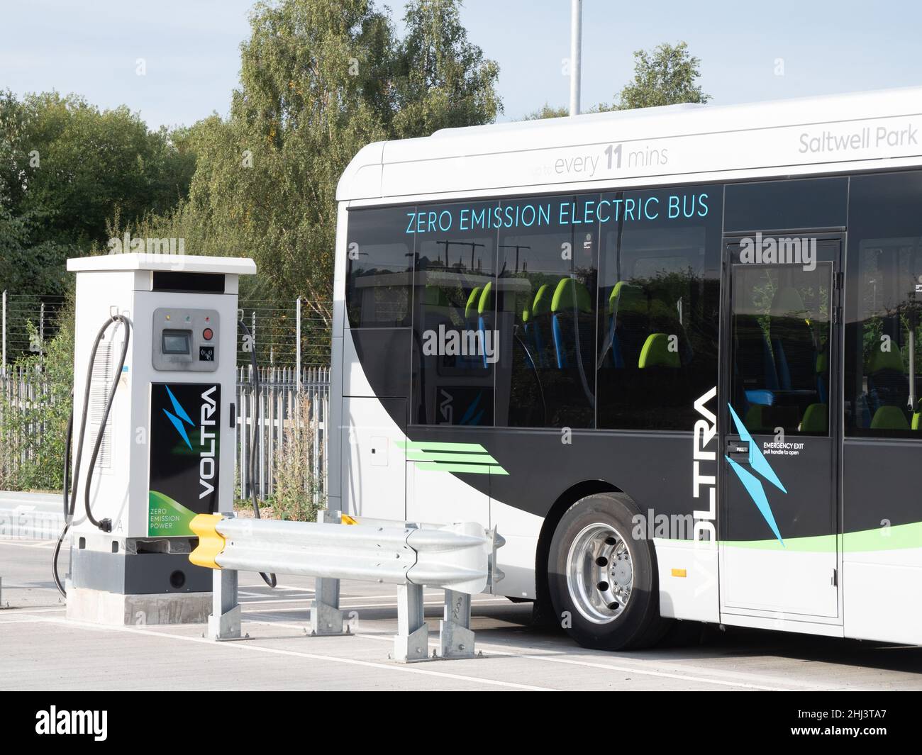 Electric bus being charged Stock Photo