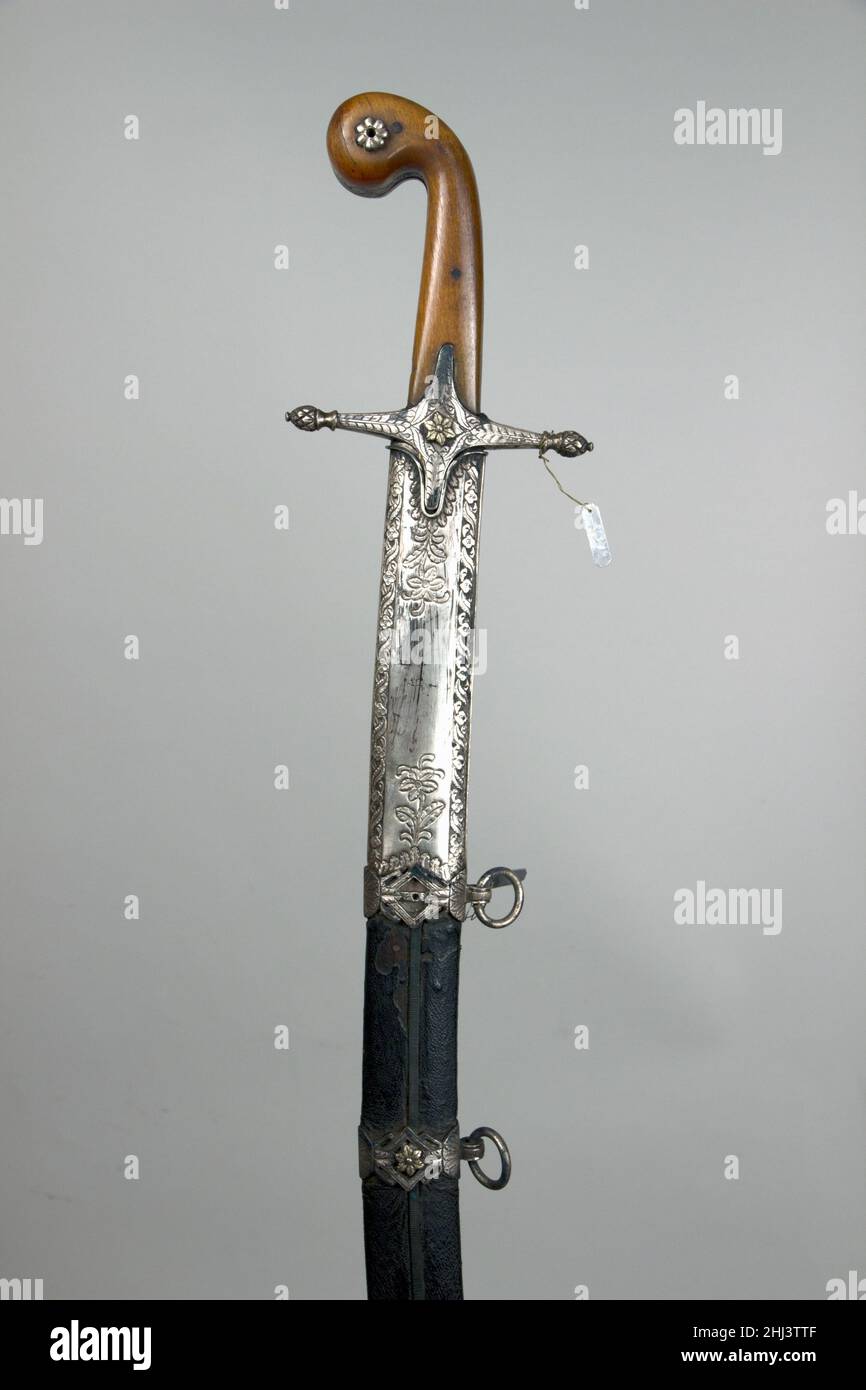 Sword (Kilij) and Scabbard with Baldric A.H. 1242/ A.D. 1826–27 Turkish. Sword (Kilij) and Scabbard with Baldric. Turkish. A.H. 1242/ A.D. 1826–27. Steel, silver, wood, horn, leather, gold, silk. Swords Stock Photo