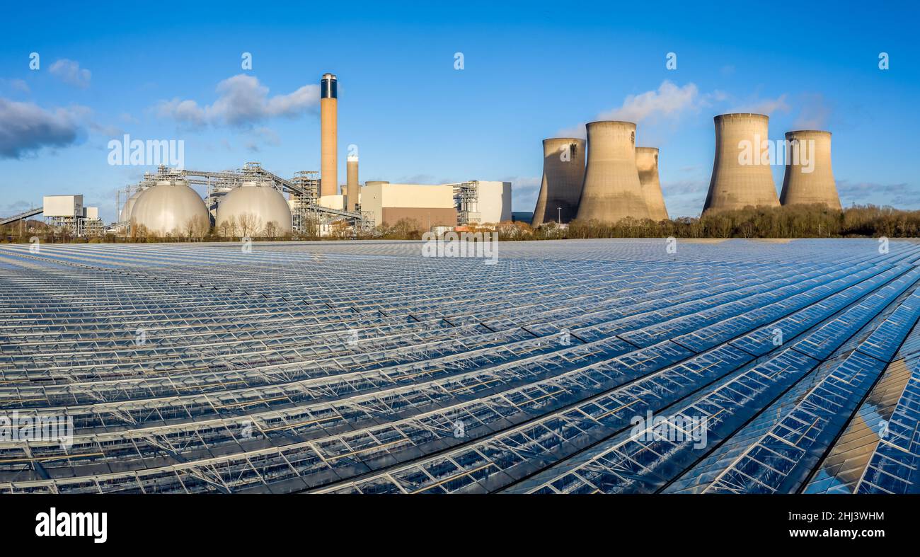 DRAX POWER STATION, DRAX, UK - JANUARY 19, 2022.  An aerial view of Drax Power Station and the greenhouses that grow salad and vegetables from the exc Stock Photo