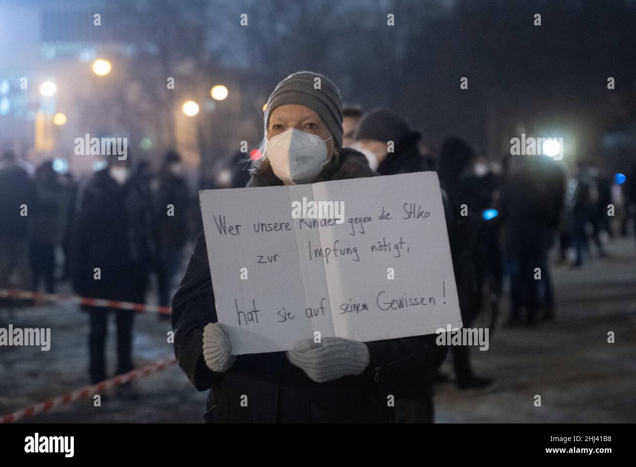 Munich, Germnay. 26th Jan, 2022. Participant with sign 'Those who force our children to vaccinate against stiko have them to his conscience'. On January 26, 2022, around 3000 anti vaxxers gathered at Koenigsplatz in Munich to demonstrate against the Covid-19 protection measures as well as compulsory vaccination. (Photo by Alexander Pohl/Sipa USA) Credit: Sipa USA/Alamy Live News Stock Photo