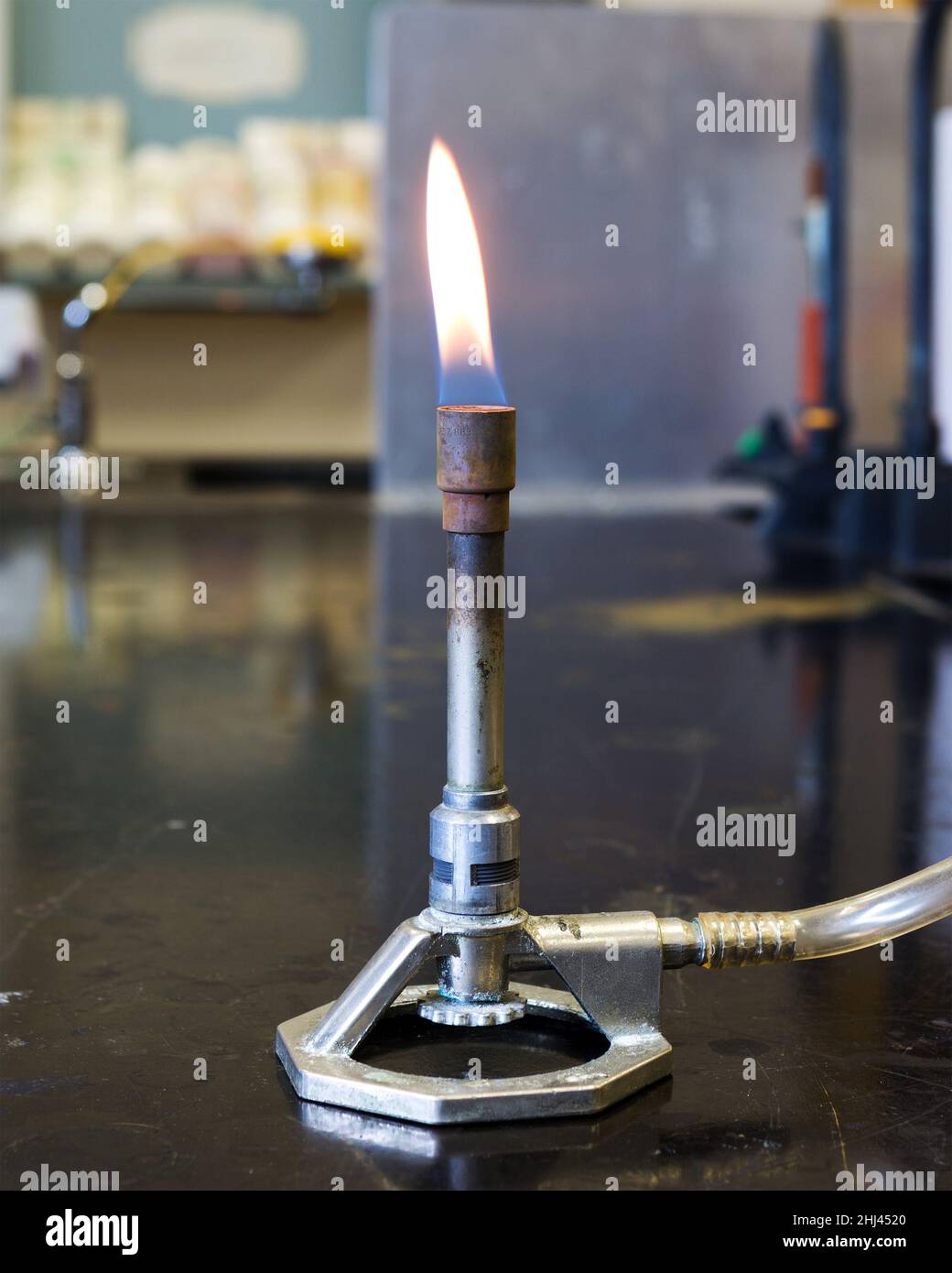 Bunsen Burner with flame adjusted for safety Stock Photo Alamy