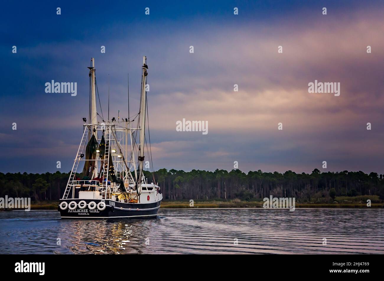 Apalachee Girl, a shrimp boat, heads home after a long day of shrimping, Oct. 27, 2013, in Bayou La Batre, Alabama. Stock Photo