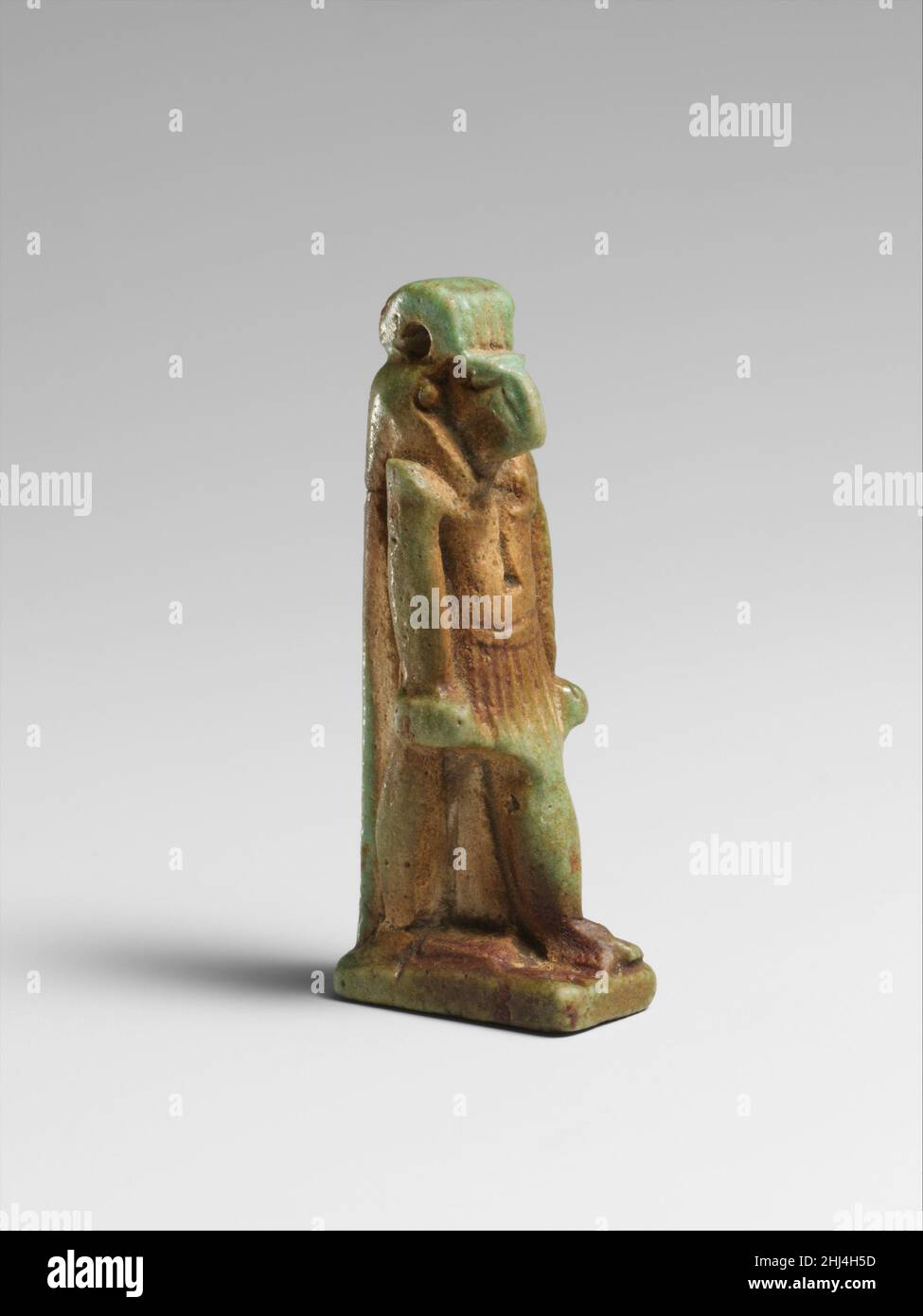 Faience amulet of Thoth 664–30 B.C. Egyptian Amulets representing animals were attributed to a deity: a hawk for Ra, the Sun God, a lion for Sakhmi, the War Goddess, a ram for Khnum and a cat for Bast.. Faience amulet of Thoth  243749 Stock Photo