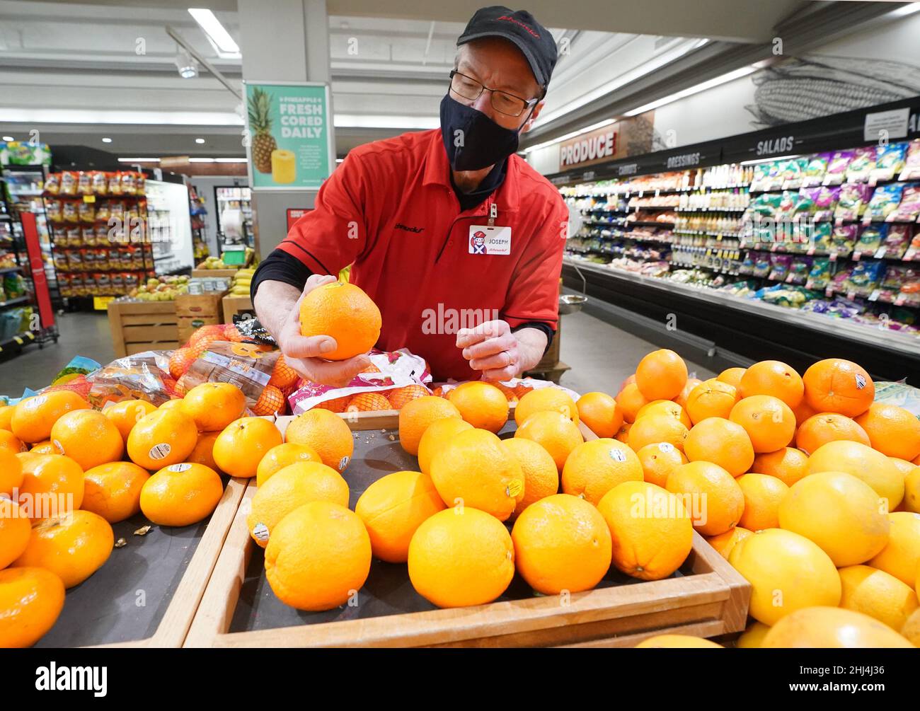 Ladue, United States. 26th Jan, 2022. Employee Joseph Hayes checks the color of a batch of oranges he has placed for sale at Schnucks Markets in Ladue, Missouri on Wednesday, January 26, 2022. The U.S. Department of Agriculture warned orange growers may see a low crop yield this year because of the Citrus Greening Diseases. Infected trees bear fruit that are smaller, higher in acidity and lower in sugar. Officials say this years crop could be one of the worst seasons since World War II. Photo by Bill Greenblatt/UPI Credit: UPI/Alamy Live News Stock Photo