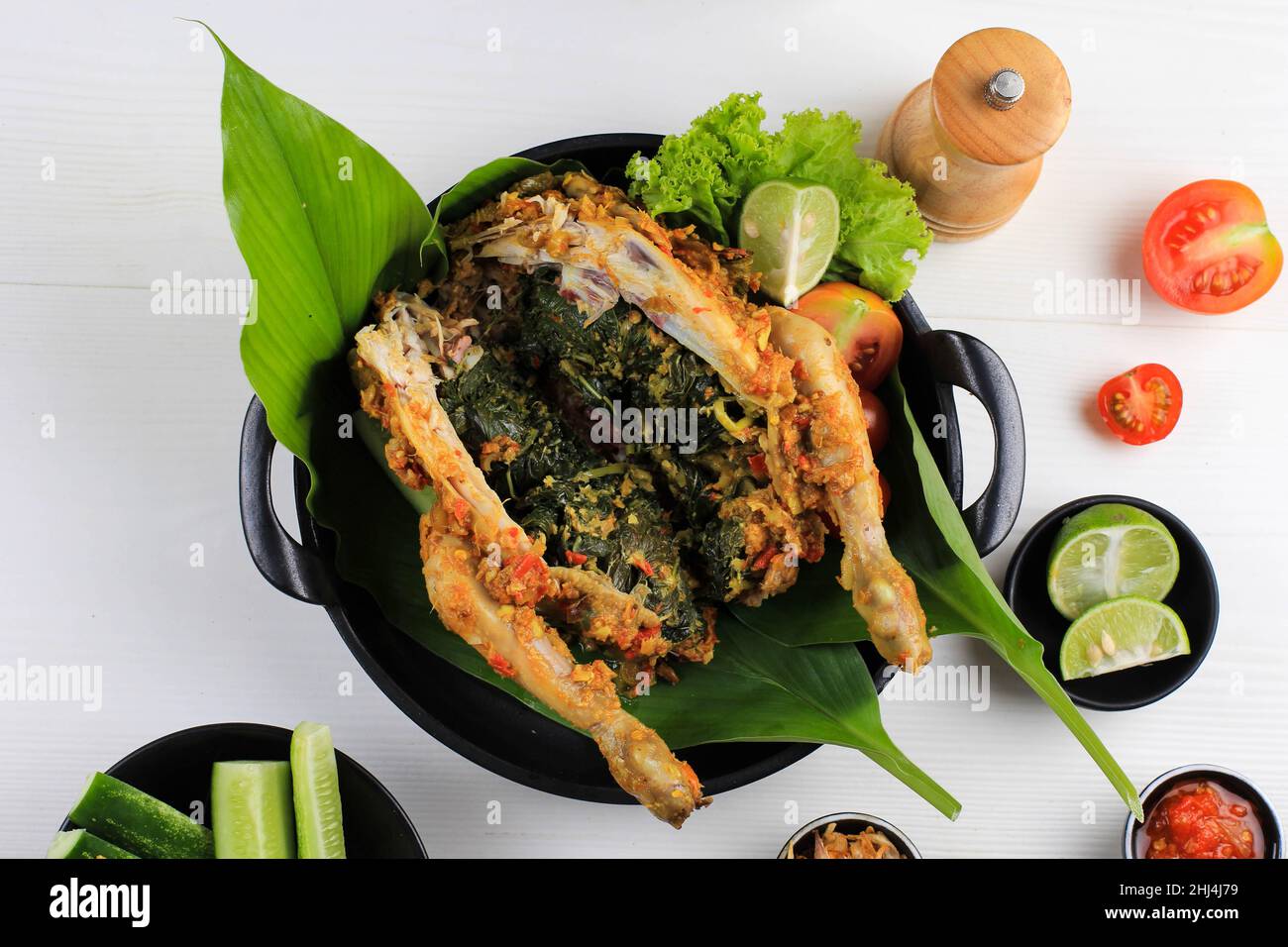 Ayam Betutu. Balinese Roast Chicken Stuffed with Cassava Leaves Stock Photo - Alamy