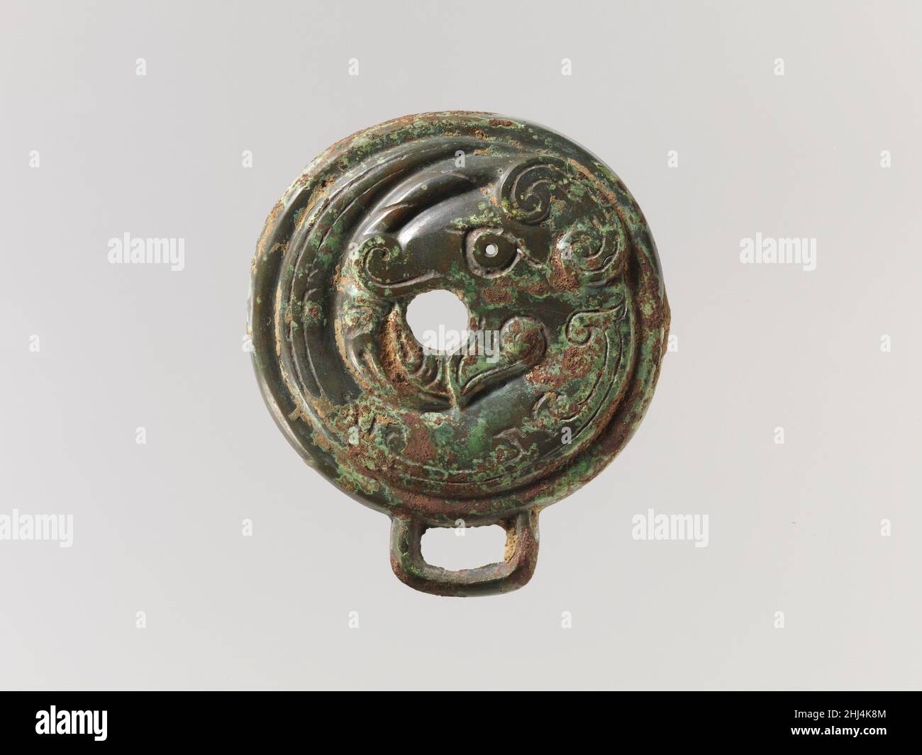 Bridle Cheekpiece 11th–10th century B.C. China. Bridle Cheekpiece. China. 11th–10th century B.C.. Bronze. Western Zhou dynasty (1046–771 B.C.). Metalwork Stock Photo