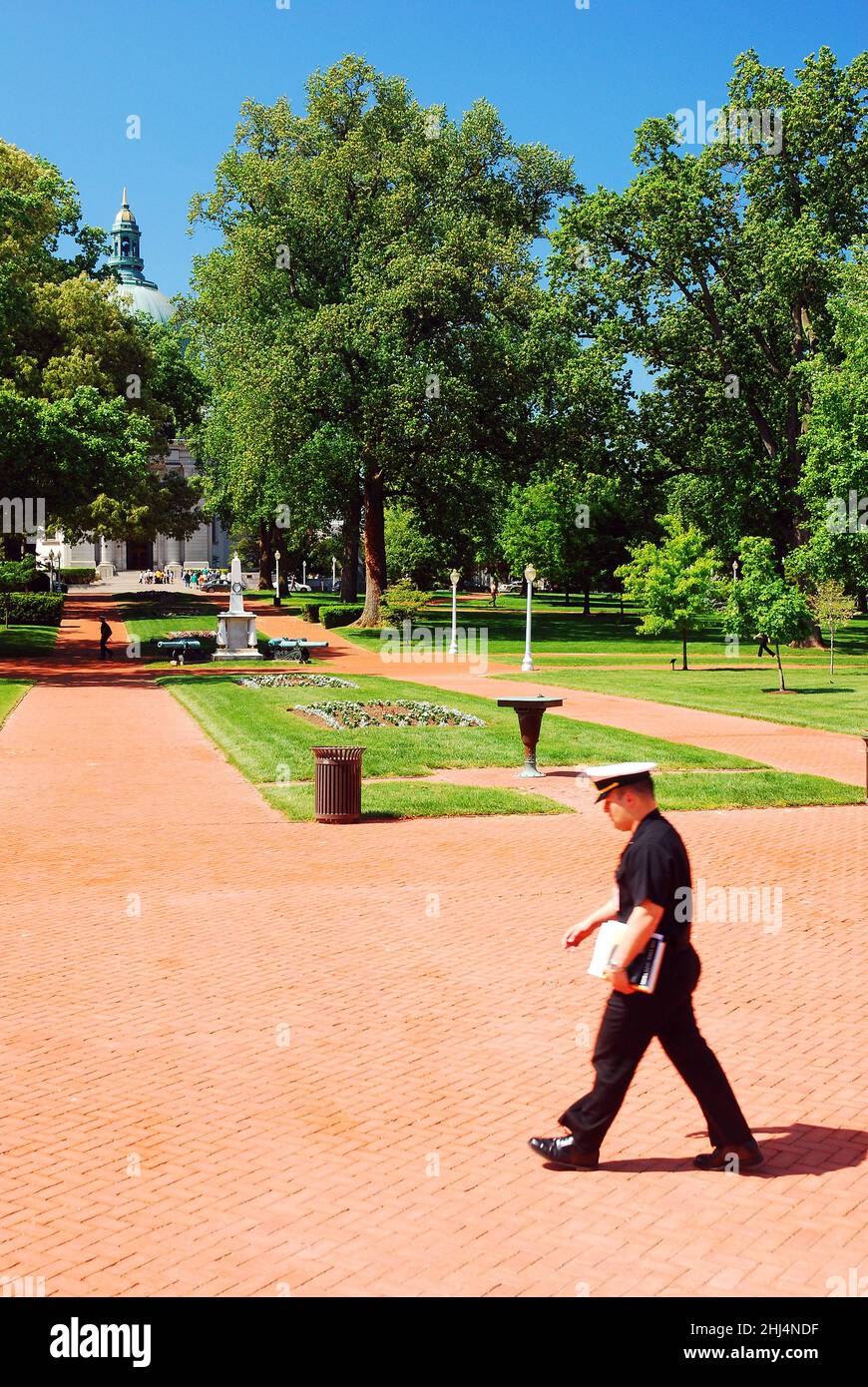 A cadet walks on the campus of the US Naval Acedemy at Annapolis Stock Photo