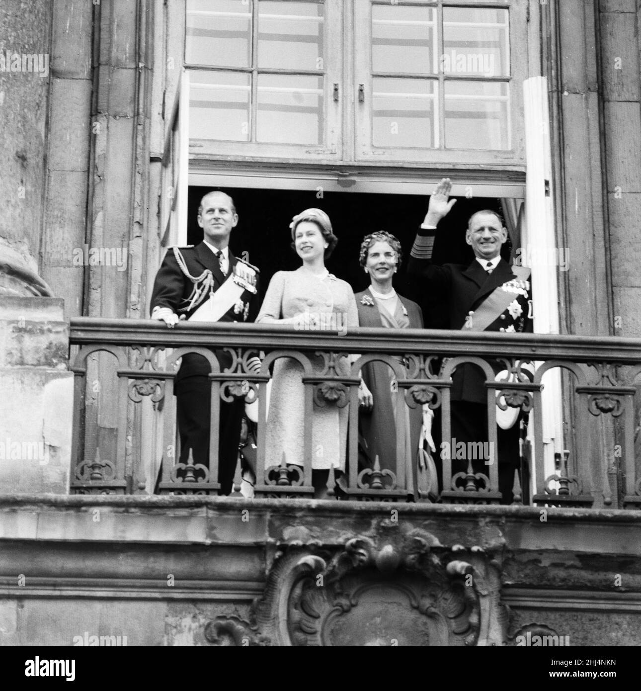 Queen Elizabeth II and Prince Philip, Duke of Edinburgh visit to Denmark. On the balcony at Amalienborg Palace, left to right, Prince Philip, Queen Elizabeth II, Queen Ingrid and King Frederik IX of Denmark. 21st May 1957. Stock Photo