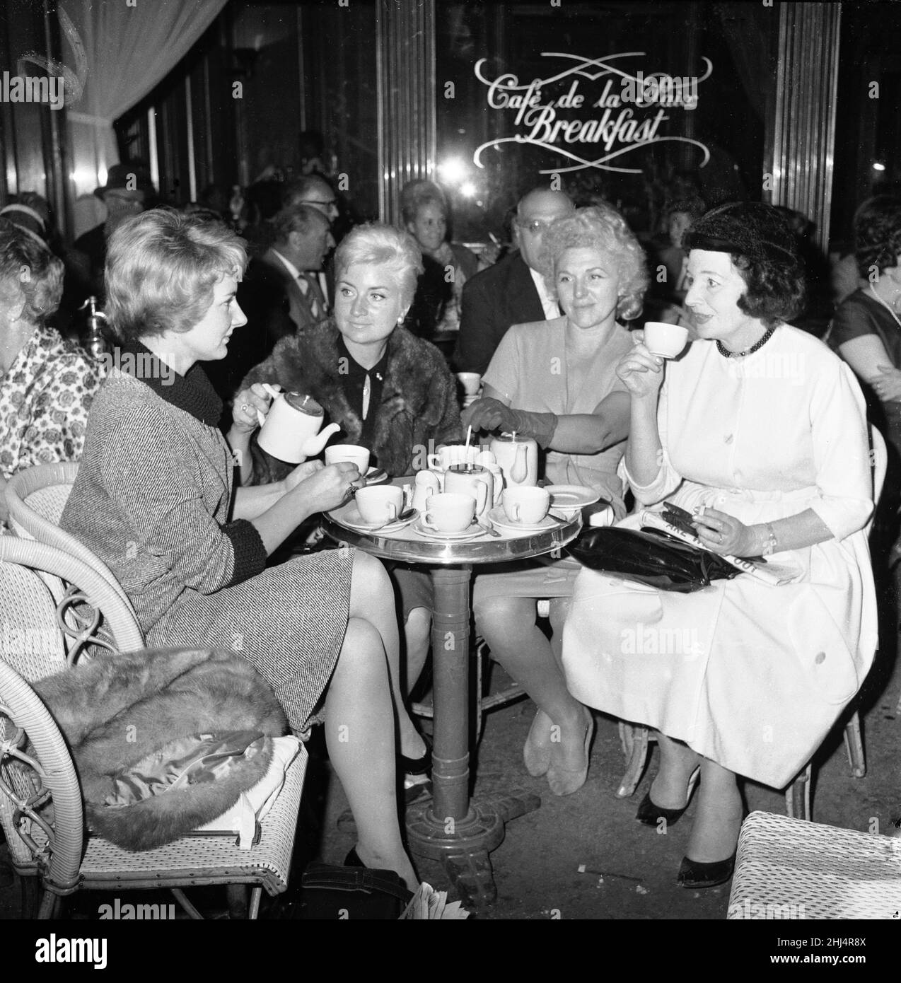 Joy Miller, wife British singer and actor Gary Miller seen here drinking tea in cafe during a visit to Paris with friends.30th September 1961. Stock Photo