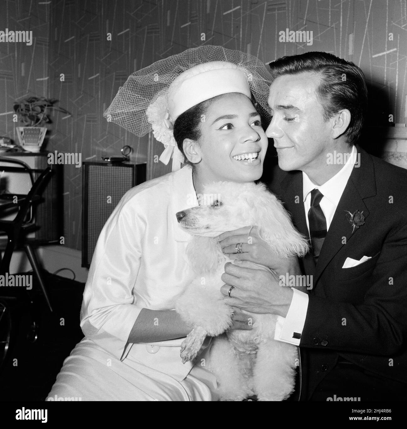 Shirley Bassey, 24, marries film director Kenneth Hume, 35, at Paddington Register Office. The happy couple with Shirley's poodle Beaujolais. 8th June 1961. Stock Photo