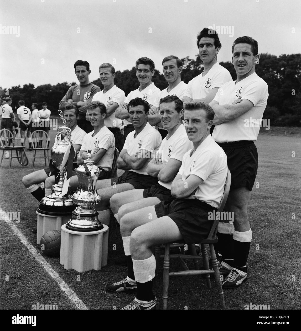 The double winning Tottenham Hotspur Football Club are pictured at Cheshunt, prior to the start of the new season. They are back row L-R: Bill Brown, Ron Henry, Peter Baker, Danny Blanchflower, Maurice Norman, and Dave Mackay. Front Row L-R: Cliff Jones, John White, Bobby Smith, Les Allen, and Terry Dyson 4th August 1961.  *** Local Caption *** Squad Stock Photo